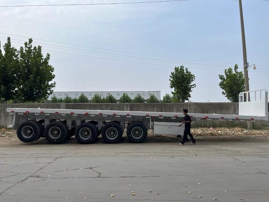 Büyük boyutlu yüklerin istikrarlı ve verimli taşınması için ağır ağırlıklı çok eksenli düz yataklı yarı römork